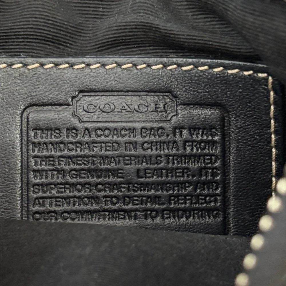 COACH vintage crossbody bag, jacquard black, adjustable strap, zipper top.